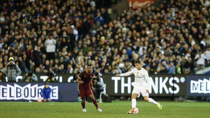 Global icon: Cristiano Ronaldo controls the ball in front of a packed crowd at the MCG. Photo: Eddie Jim