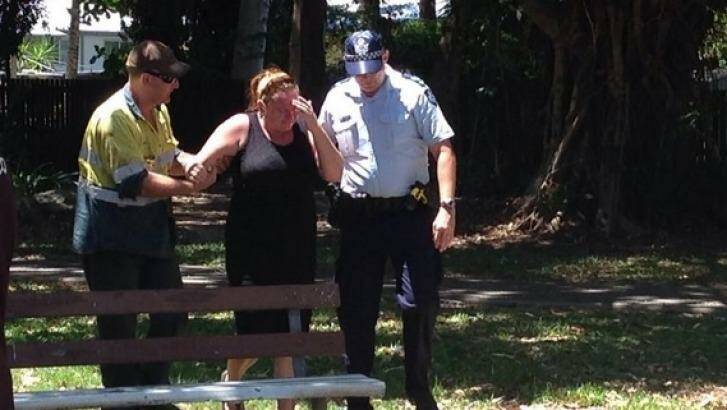 Police and residents at the scene of the Cairns stabbing. Photo: Sharnie Kim/ABC News, via Twitter