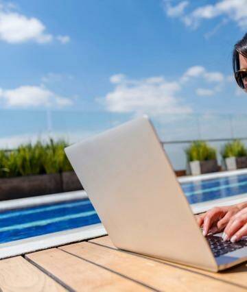 Being a travel writer isn't all relaxing by the pool with a cocktail: Just some of it is. Photo: iStock