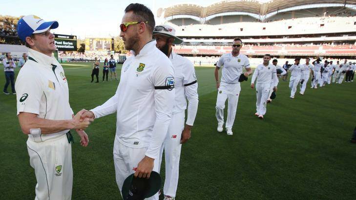 Well-earned win: Australian captain Steven Smith with South African counterpart Faf du Plessis. Photo: RICK RYCROFT