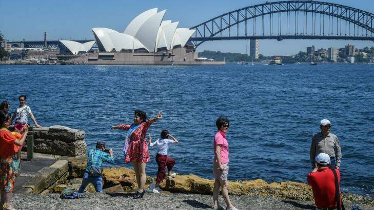 Chinese Tourists enjoy the Sydney sun at Sydney's Lady Macquaries Chair. Photo: Brendan Esposito