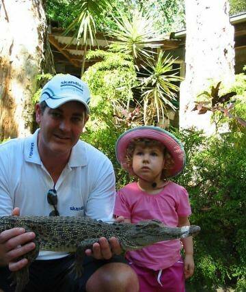 Day 2 winner: Jane Milne sent us a picture of her husband and daughter with a small croc. The look on her daughter's face is fearless.