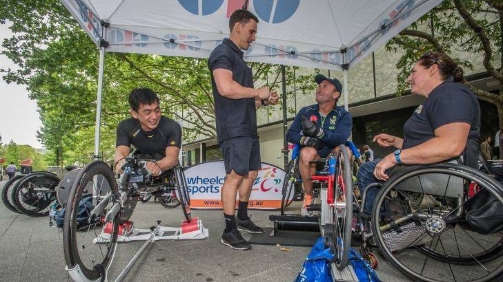 Ricky Stuart gets tips at the launch of the Wheelchair Sport Summer Down Under series in Canberra on Thursday. Photo: Karleen Minney
