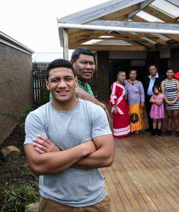 Patrick Mago with his father Pele and extended family in Macgregor.