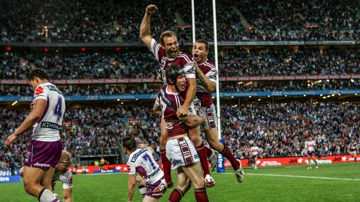 Grand finale: Steve Menzies (headgear) celebrates with Brett Stewart and Anthony Watmough after scoring a try in his final game for Manly in the 2008 NRL grand final. Photo: Dallas Kilponen