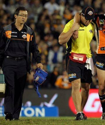 Familiar sight: Tim Moltzen leaves the field injured in round 7, 2013. Photo: Jonathan Ng