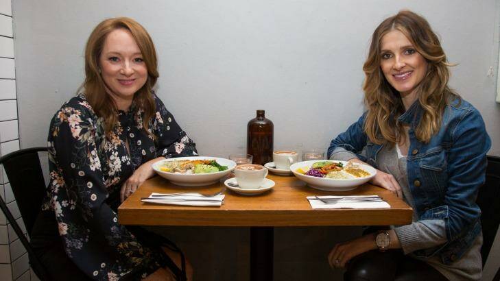 Mandy McElhinney (left) and Kate Waterhouse enjoy a salad at The Roots Next Door. Photo: Edwina Pickles