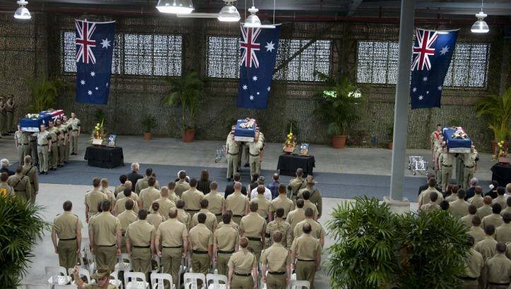 The coffins of Australian soldiers Lance Corporal Rick Milosevic, Sapper James Martin and Private Robert Poate at a repatriation ceremony in RAAF Base Amberley on September 5, 2012.  Photo: Harrison Saragossi