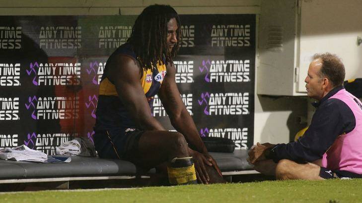 A dejected Nic Naitanui on the Eagles bench on Friday night. Photo: Getty Images/AFL Media