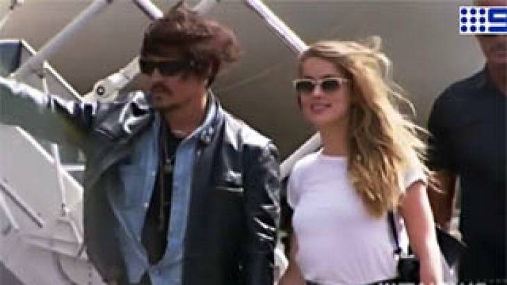 Johnny Depp and Amber Heard at Brisbane Airport Photo: Nine News