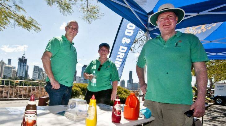Harry Zirkle, Ros Kelly and Anton Brown of the Rotary Club of Woolloongabba at Kangaroo Point Cliffs in preparation for Riverfire. . Photo: Robert Shakespeare