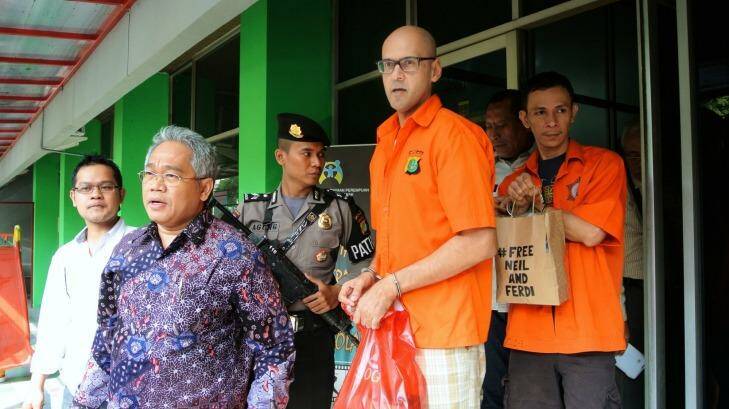 Neil Bantleman and Ferdinant Tjiong leaving the police station to be transferred to prison.  Photo: Michael Bachelard