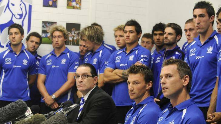 Apologetic: North Melbourne's entire playing list fronts the media in 2009. Photo: Sebastian Costanzo