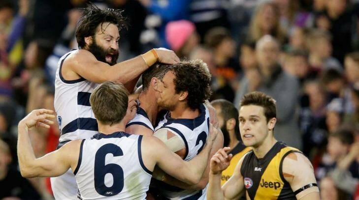 Purring along nicely: Geelong players celebrate a Tom Hawkins goal. Photo: Darrian Traynor/AFL Media
