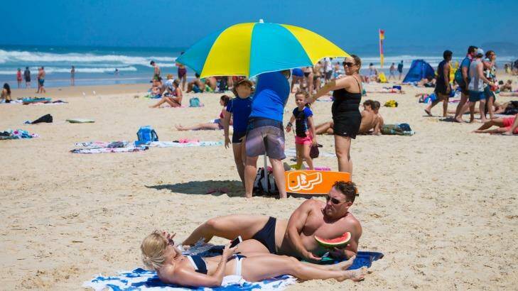 Queenslanders hit the beach in droves on Saturday. Photo: Glenn Hunt