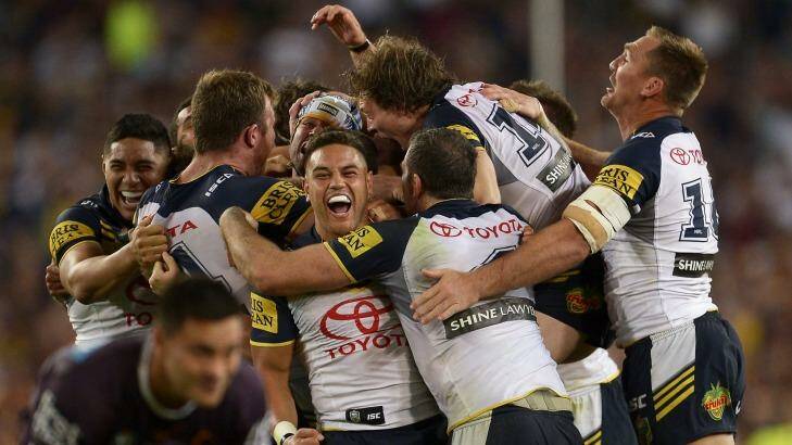 Grandest game of the year: The Cowboys players celebrate their victory over the Broncos which was extremely popular with television viewers.  Photo: Brett Hemmings