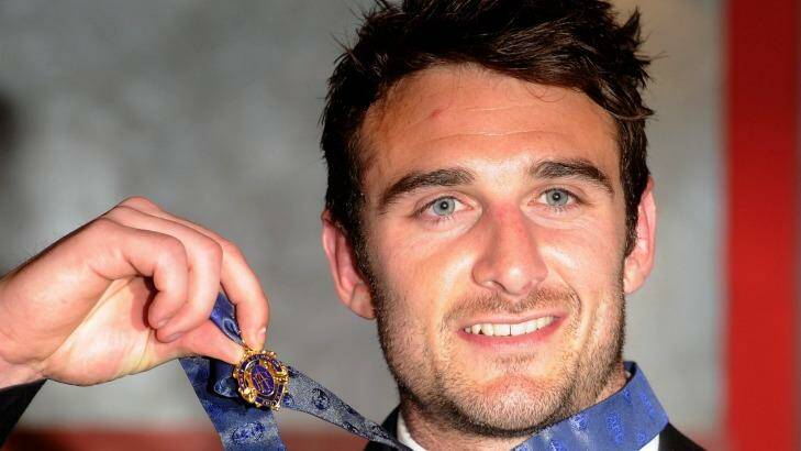 Banned Essendon player Jobe Watson with his 2012 Brownlow Medal. Photo: Sebastian Costanzo