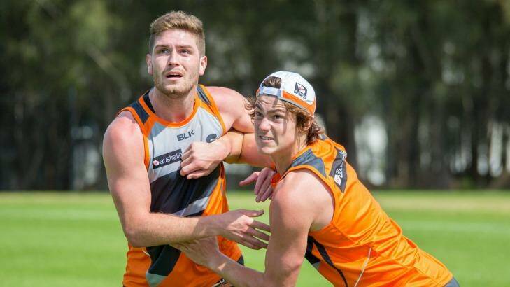 Jack Steele competes with Tomas Bugg during Giants' pre-season training