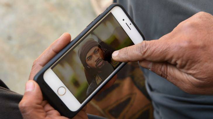 Yusuf Abbas, 51, points to a photo of Neil Prakash identifying him as the foreign fighter he saw in Mosul. Photo: Kate Geraghty