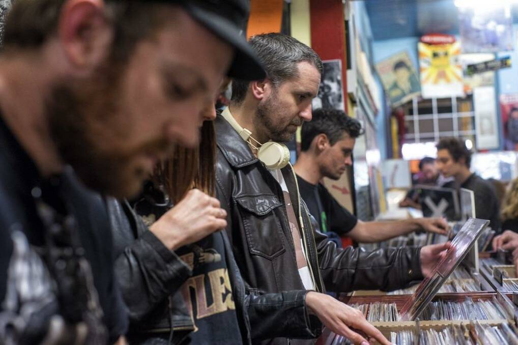 Around the world, vinyl fans scour old and new stock. Photo: Luis Ascui