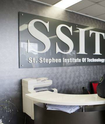 AFP officers at St Stephens Institute of Technology. Its owners were charged with serious fraud offences on Wednesday. Photo: Supplied