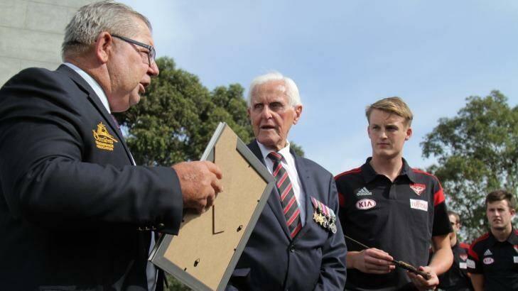 Barry Gracey (left) with World War II veteran Jack Jones and young Essendon players at Pozieres earlier this year. Mr Gracey and his wife Yvonne will receive the Legion d'Honneur for their efforts to have the history of Pozieres recognised. Photo: Julian Wallace