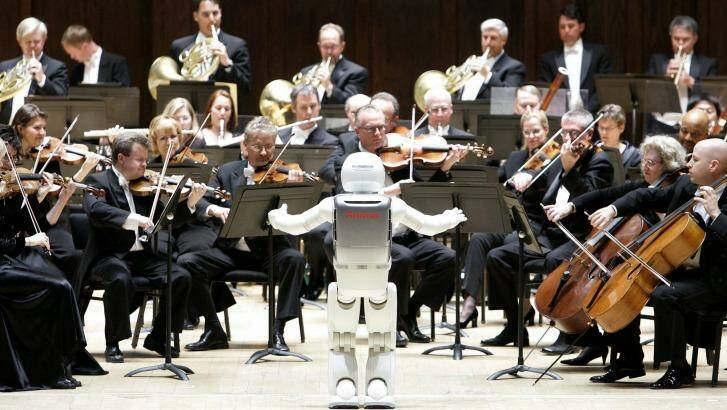 Honda's ASIMO robot conducts the Detroit Symphony Orchestra in May 2008. Photo: Paul Sancya