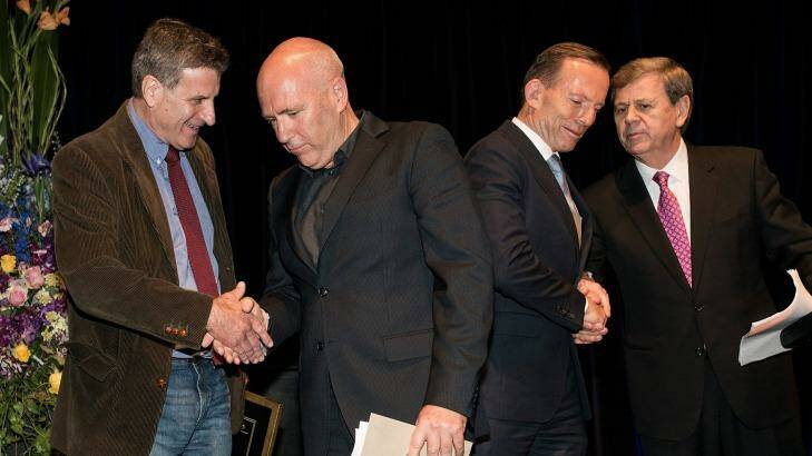 Joint fiction award winners, Steven Carroll (left) and Richard Flanagan, with the Prime Minister Tony Abbott and awards host Ray Martin. Photo: John Robenstone
