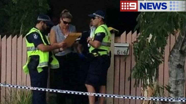 Police outside the scene of a fatal house fire at Inala. Photo: Channel 9
