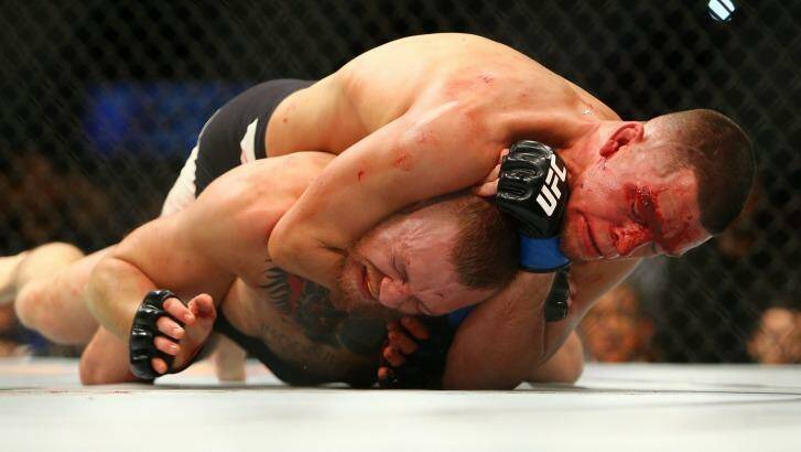 Nate Diaz applies a choke hold to win by submission against Conor McGregor. Photo: Getty Images 