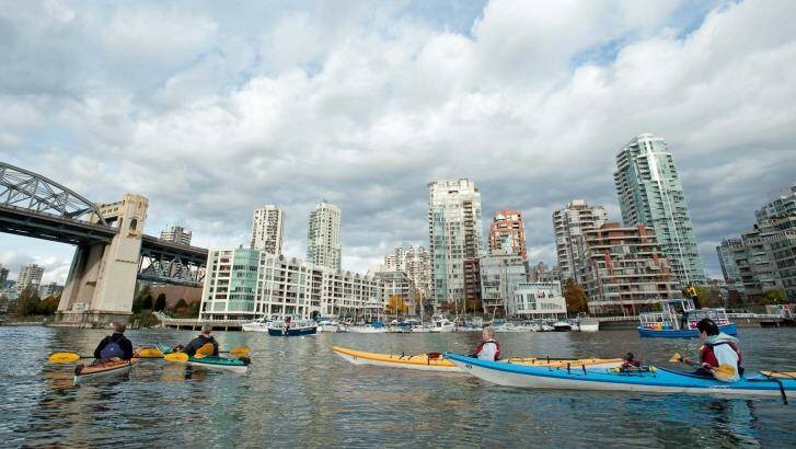 Kayaking near Burrard Bridge in False Creek, Vancouver.