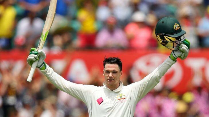 Milestone: Handscomb salutes the crowd after reaching three figures. Photo: Cameron Spencer