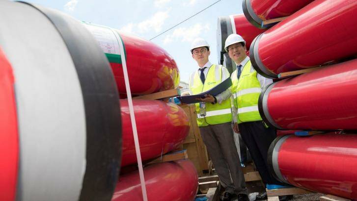 Envac Korea senior manager Daniel Parks and CEO Stephen Bahng Parks inspect pipes that have arrived to form Australia's first underground waste disposal network. Photo: Supplied