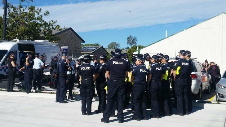 Off-duty officers from as far as Morningside, Brisbane gather to search for the missing girl. Photo: Queensland Police Service