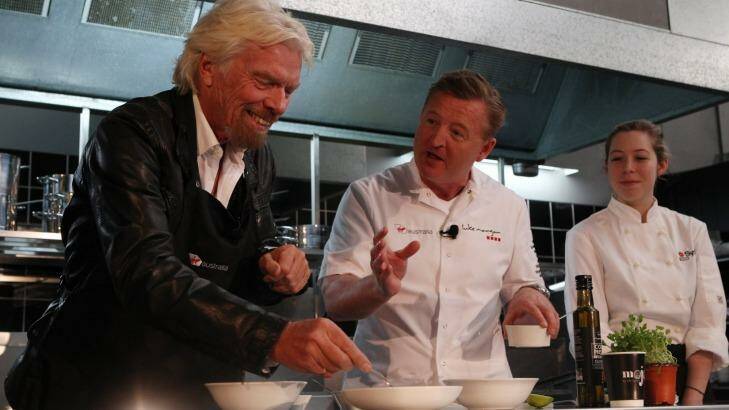 Richard Branson (L) gets a lessson from Luke Mangan on how to make meals look good. Photo: Peter Braig
