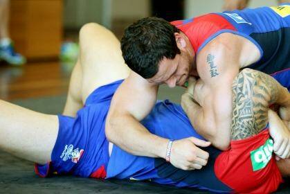 Wrestlemania: Jarrod Mullen performs a wrestling exercise at Knights training last year. Photo: Ryan Osland