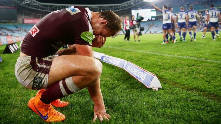 Dejected: Daly Cherry-Evans is shattered after Canterbury's final try to Corey Thompson at ANZ Stadium. Photo: Matt King