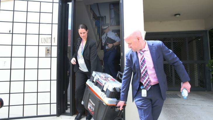 Under investigation: Police leave the office of Sam Ayoub. Photo: Louise Kennerley