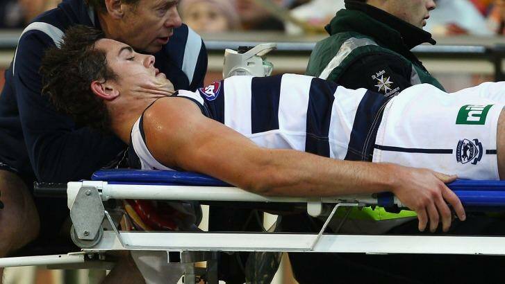 Five years ago: Daniel Menzel is stretchered off in the 2011 qualifying final. Photo: Mark Dadswell