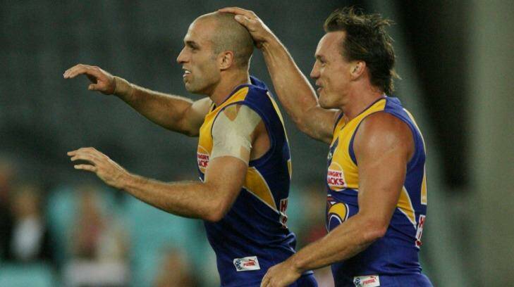 Daniel Chick and Chris Judd have different recollections of West Coast's tumultuous past. Photo: Vince Caligiuri