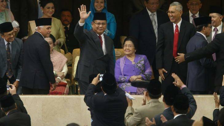 Mr Joko's rival for the presidency, Prabowo Subianto, attended the  ceremony. Photo: Alex Ellinghausen