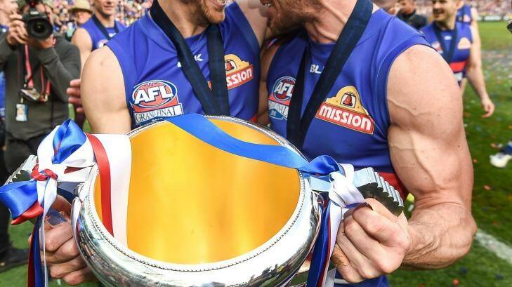 The Age, News, 30/09/2016, photo by Justin McManus. AFL Grand Final Parade. Western Bulldogs and Sydney Swans. Easton Wood and Dale Morris celebrate with the cup. Photo: Justin McManus
