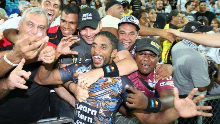 Mobbed: Preston Campbell is hailed by jubilant fans after the inaugural Indigenous All Stars match in 2010. Photo: Paul Harris