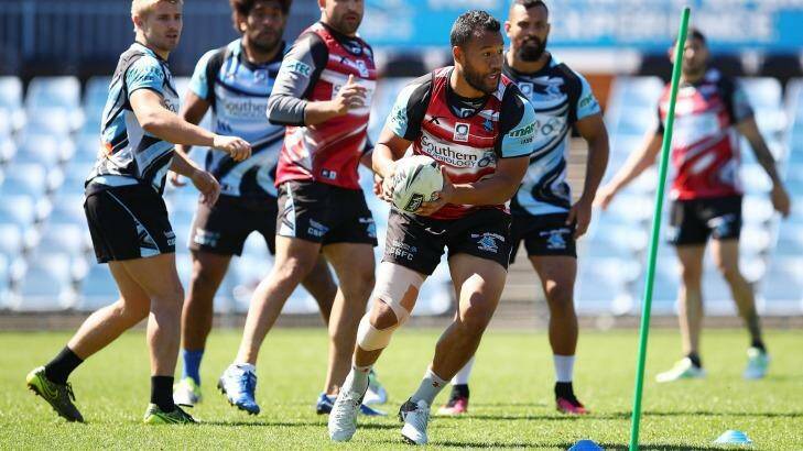 In the mix: Joseph Paulo runs the ball at training. Photo: Brendon Thorne