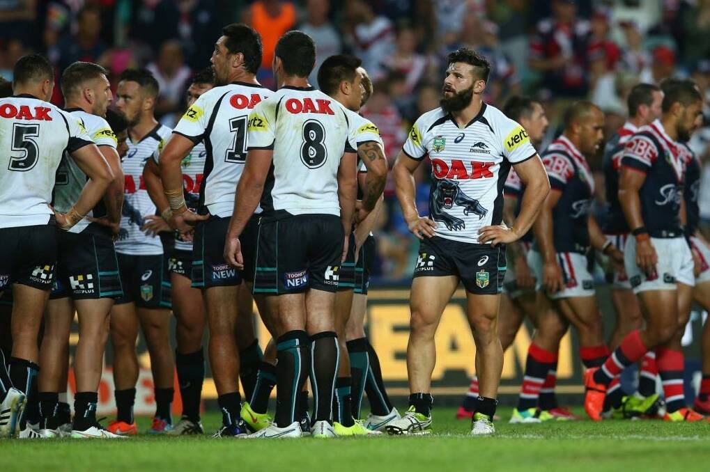 Dejection: Josh Mansour and his Penrith teammates on Monday night. Photo: Mark Kolbe