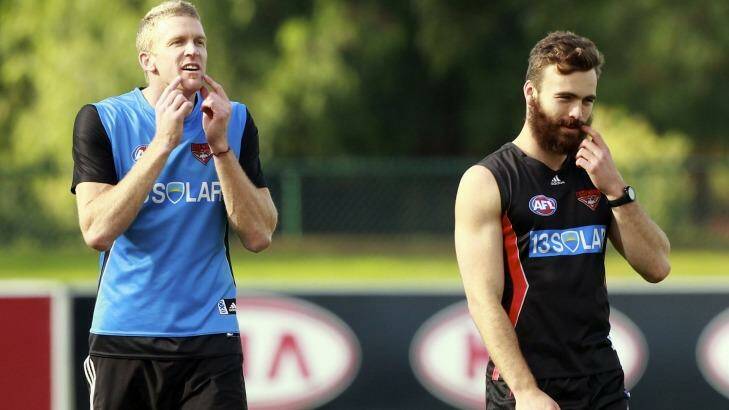 Essendon veteran Dustin Fletcher with rookie Hal Hunter during the Bombers training session at Windy Hill in  2012. Photo: Paul Rovere
