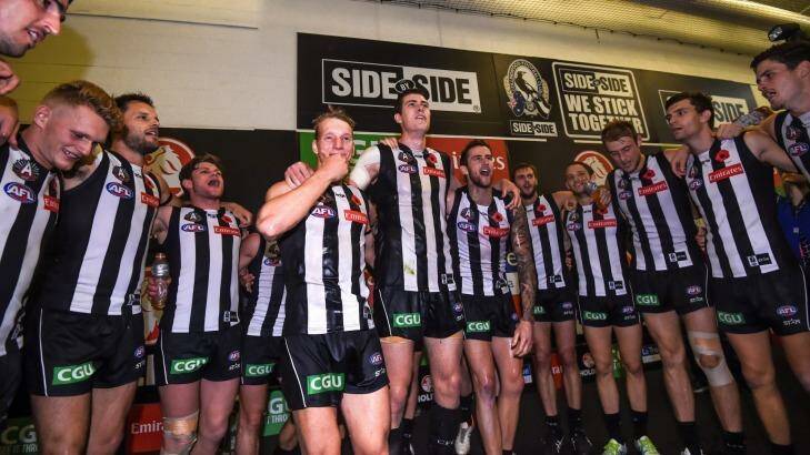 First game: Mason Cox (centre) celebrates with his Magpie teammates after their big win on Anzac Day. Photo: Justin McManus