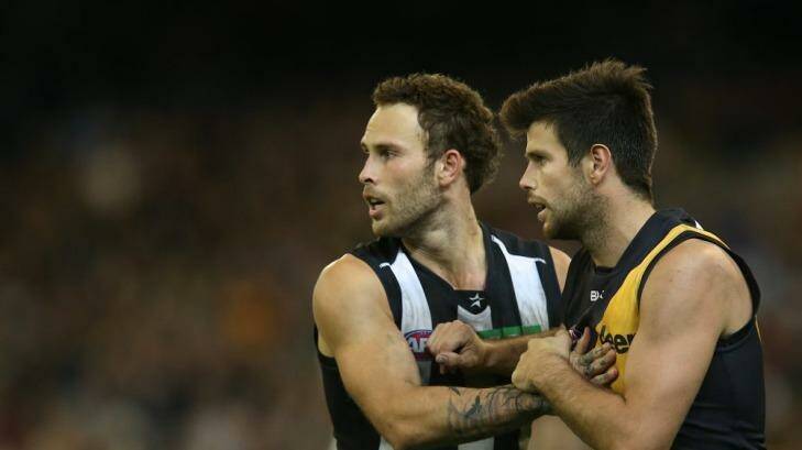 Brent Macaffer and Trent Cotchin tussle at the MCG on Friday night. Photo: Pat Scala