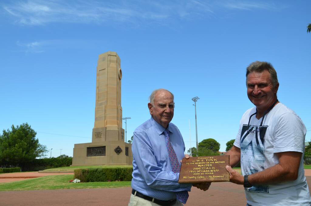 Bucky Tink and John Van Der Reyden with the plaque. Photo: JENNIFER HOAR