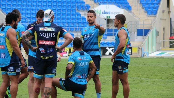 Centre of attention: Jarryd Hayne with his new teammates. Photo: Gold Coast Titans